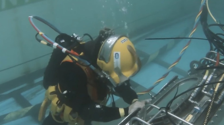 A diver repairing an undersea cable