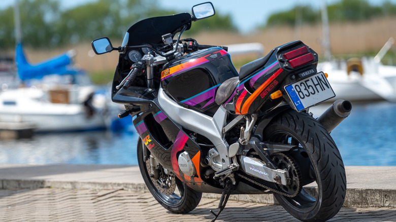 Yamaha motorcycle parked on marina walkway