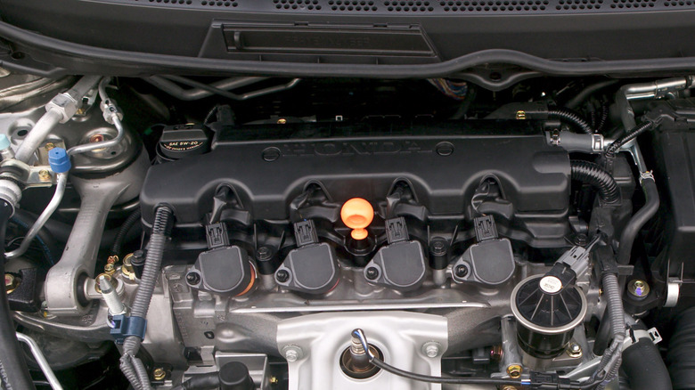 2007 Honda Civic engine in the engine bay with ignition coils visible