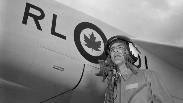 A pilot stands before Arvo's CF-105 Arrow: Canada's last homegrown fighter jet.