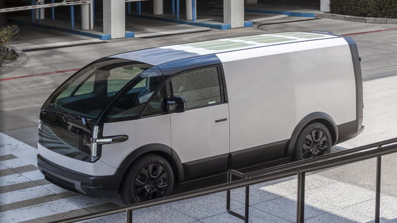 White Canoo delivery van parked in city