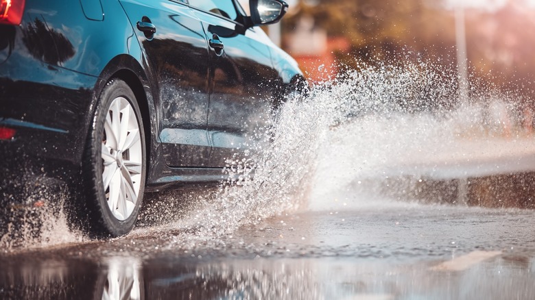 Car driving in the rain