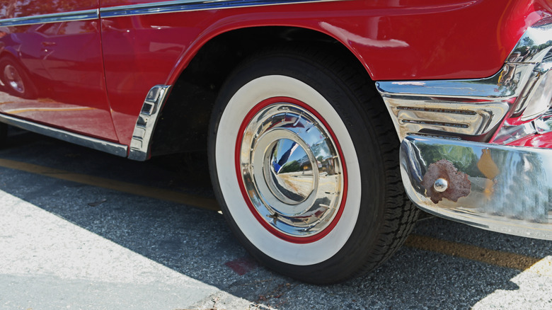 Whitewall tire on red classic car