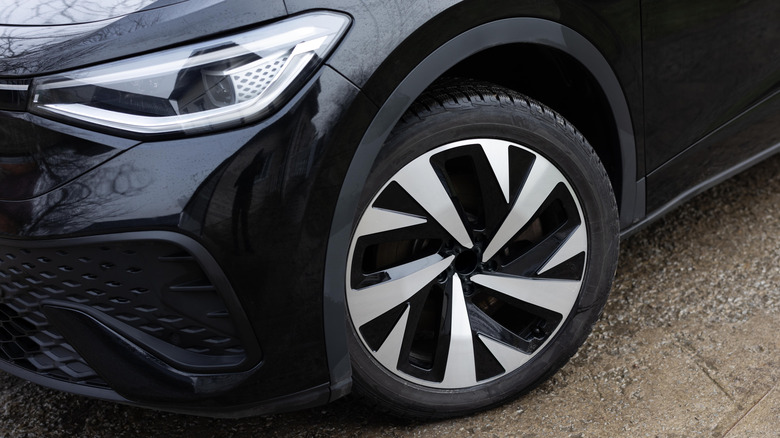 Close-up of car tire with wheel angled