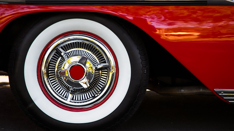 White wall tire on a red classic 1950s car