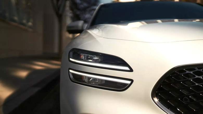 Close up picture of a Genesis G70's headlamp and grill