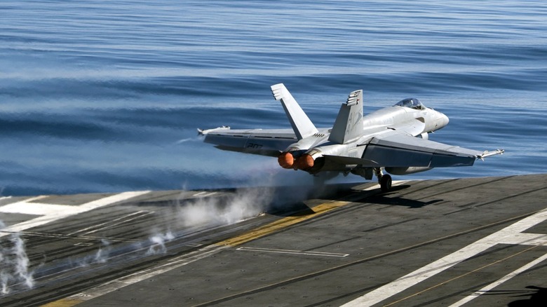 An F/A-18 taking off from the USS Carl Vinson