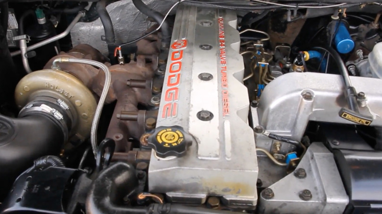 close up view of a Cummins 12-valve 5.9L 6BT engine in a 1998 Dodge Ram 2500 HD