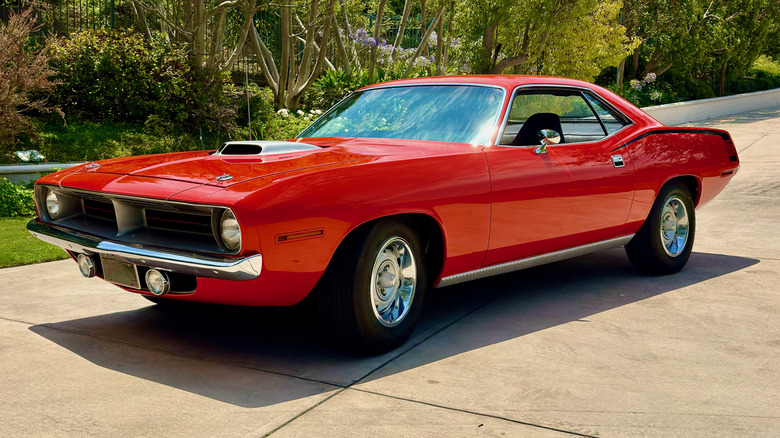 Red 1970 426 Hemi Coupe parked in driveway