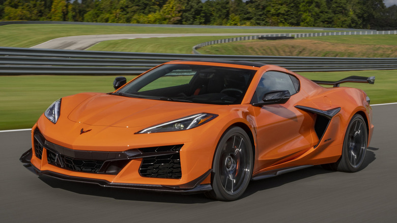 Front 3/4 view of orange Corvette Z06 in track setting