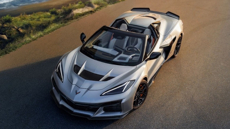 Overhead front 3/4 view of silver Corvette ZR1X by the sea