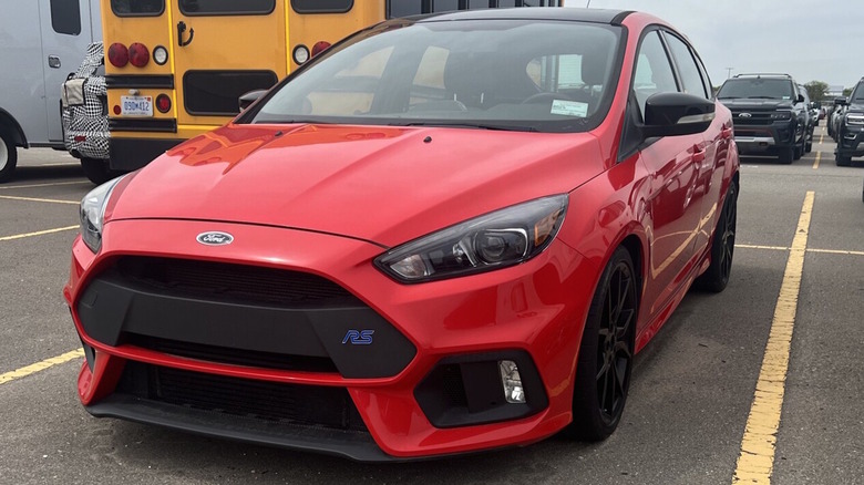 A red 2018 Ford Focus RS in a parking lot.