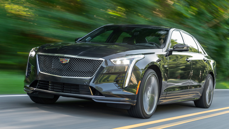 Front 3/4 view of 2019 black Cadillac CT6-V driving on road