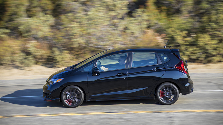 Black 2018 Honda Fit driving on road
