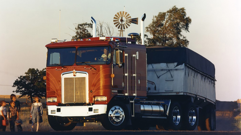 Front-left 3/4 shot of a Kenworth K100 cab-over-engine model