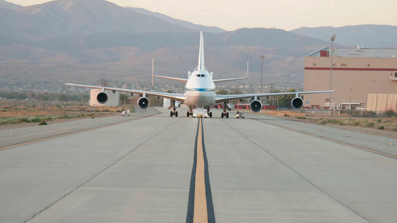 NASA 911, one of two retired Shuttle Carrier Aircraft that ferried NASA's space shuttles across the country for three decades, is towed along a taxiway
