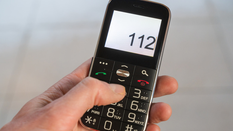 A person typing on a mobile phone.