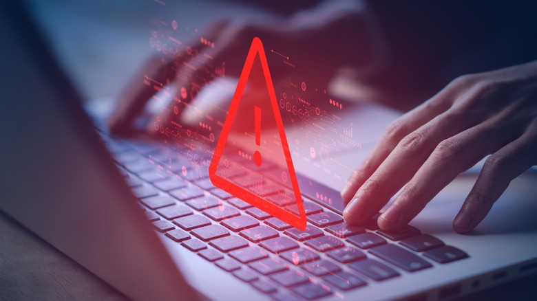 Warning sign over a computer 