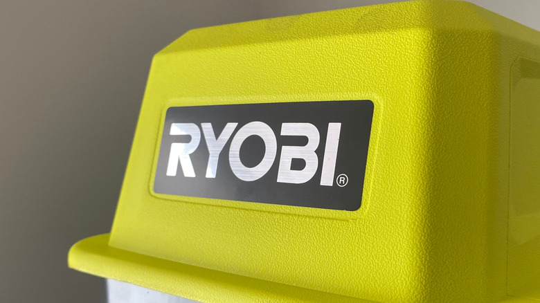The Ryobi logo on a Ryobi tool.