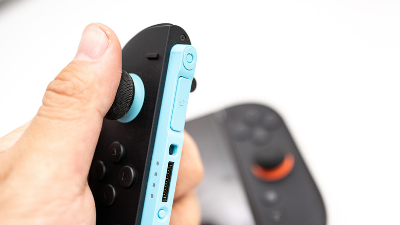 A close-up of a black and blue Nintendo Switch 2 Joy-Con controller