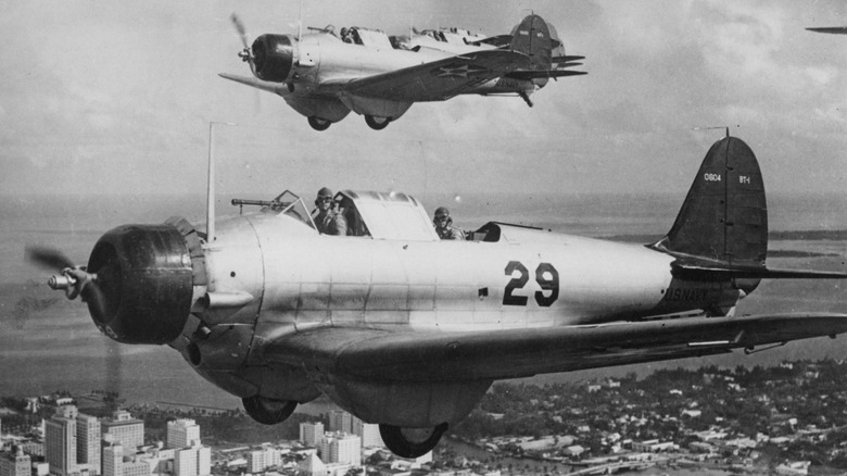 United States Navy Northrop BT-1 single-engine monoplane dive bombers of Naval Air Operational Training Command (NAOTC) flying in formation on a training flight circa October 1941 over Miami, Florida, United States.
