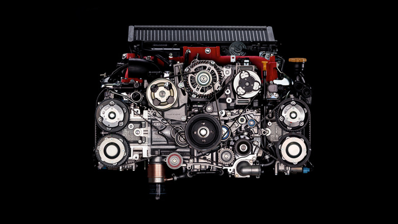 Subaru EJ20 standalone engine on black background