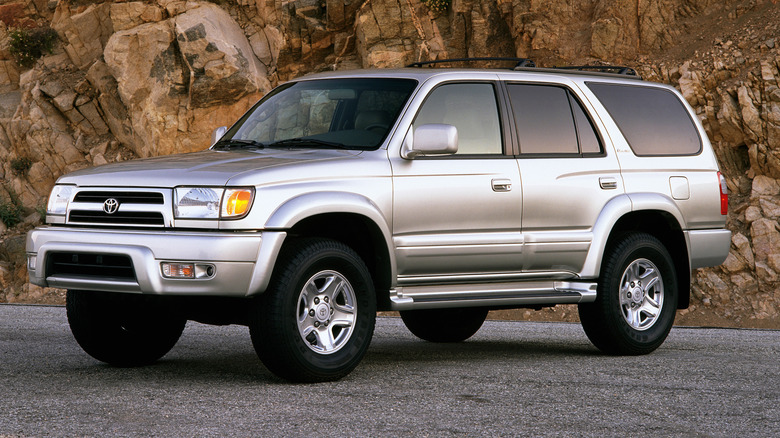 Third-gen Toyota 4Runner parked on a paved surface with a cliff in the background