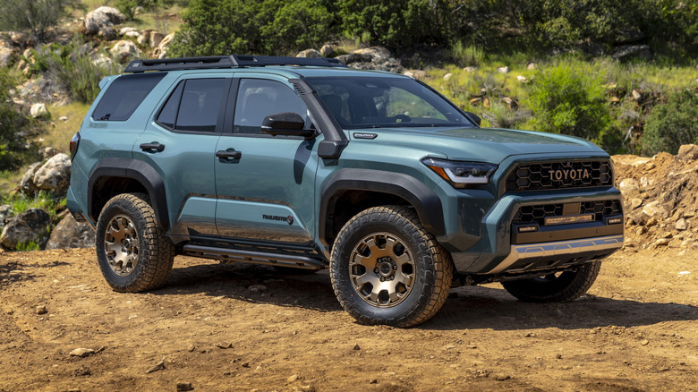 Static shot of a 2025 Toyota 4Runner Trailhunter in a rocky off-road environment