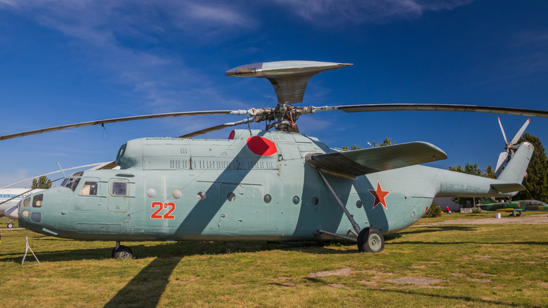 Exterior view of a Mil Mi-6 super heavy-lift helicopter with green military painting