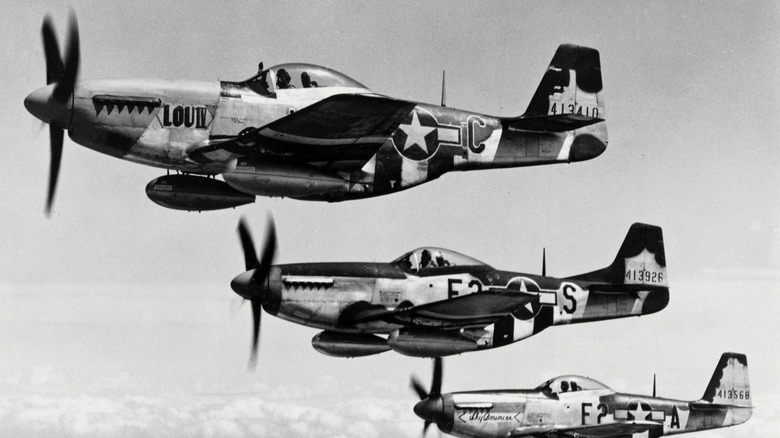 Black and white photo three P-51s in formation