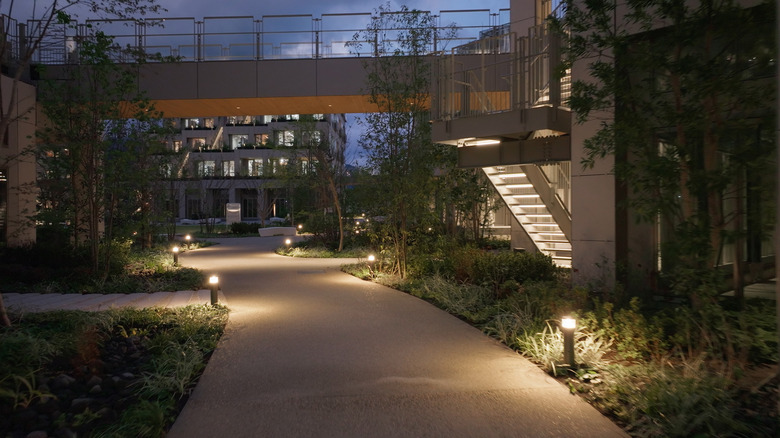 Woven City walkway with vegetation and buildings