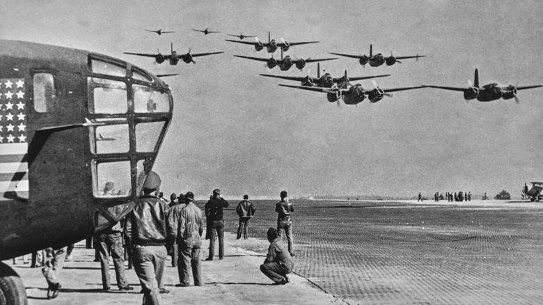 Bomber aircraft convoy near airstrip