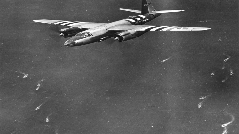 A B-26 Marauder of the 9th USAF attacks gun installations and coastal defenses during D-Day.
