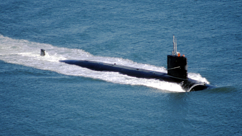 High Angle View Of Navy Submarine In Sea Against Sky