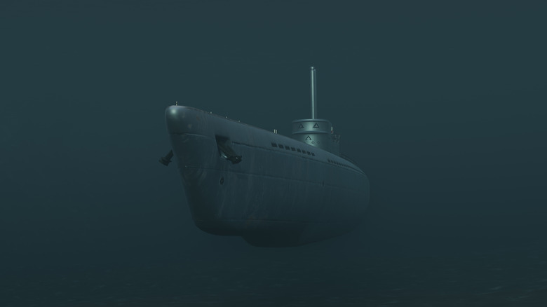 Front view of a submarine sailing under the sea in close-up