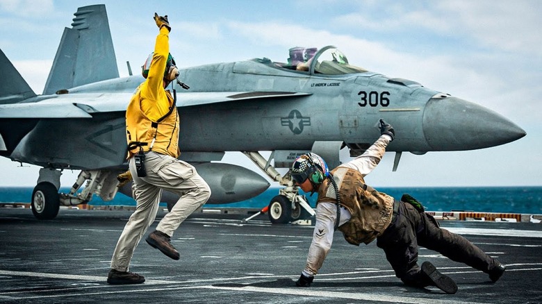 Flight deck operations on the deck of an aircraft carrier
