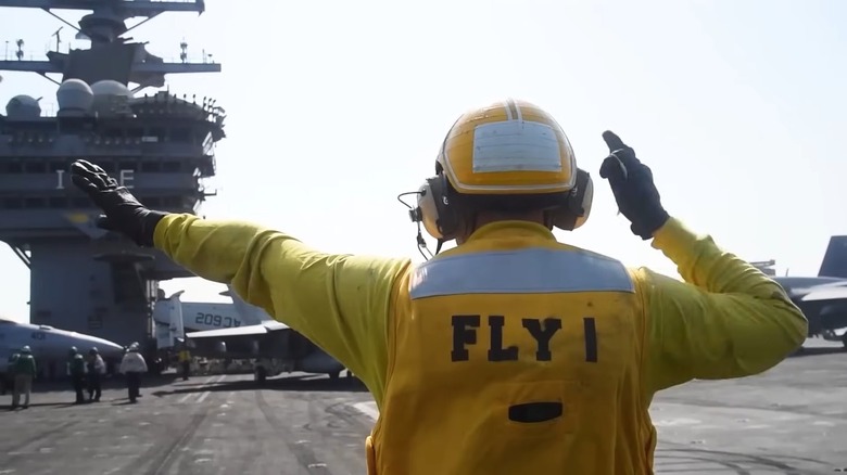 Flight deck operations on the deck of an aircraft carrier