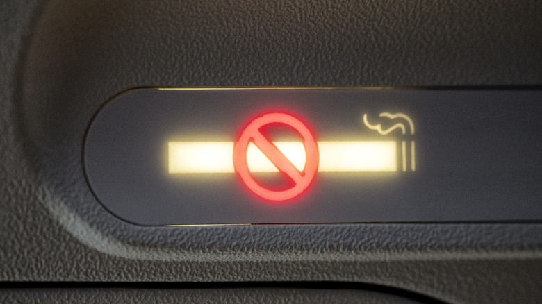 Illuminated No Smoking light on an airplane