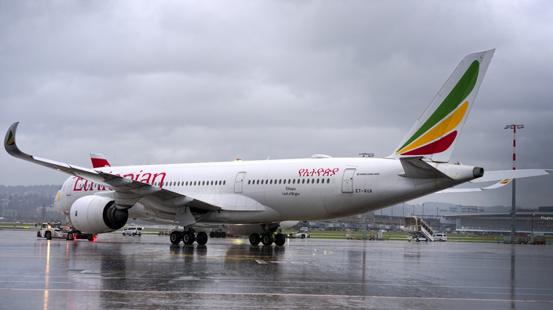 Airplane on the runway in the rain