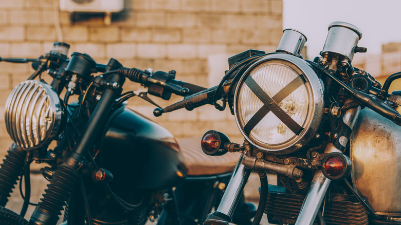 Two vintage café racer Motorcycles standing side by side