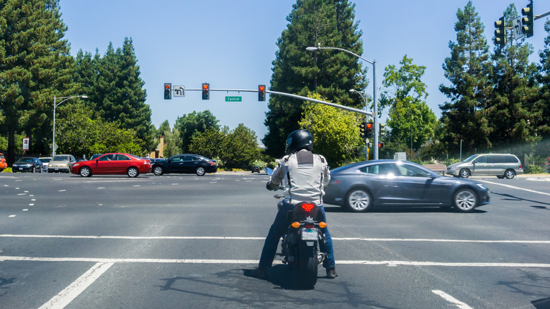 Motorcyclist waiting at a traffic light