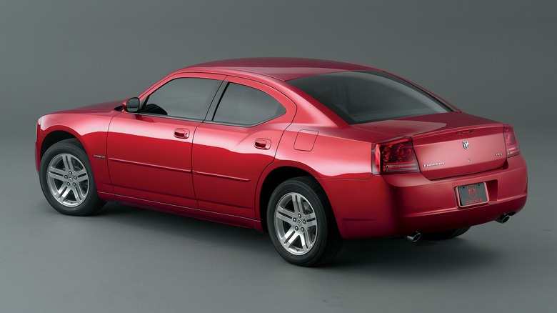 A 2006 Dodge Charger in red with a gray background