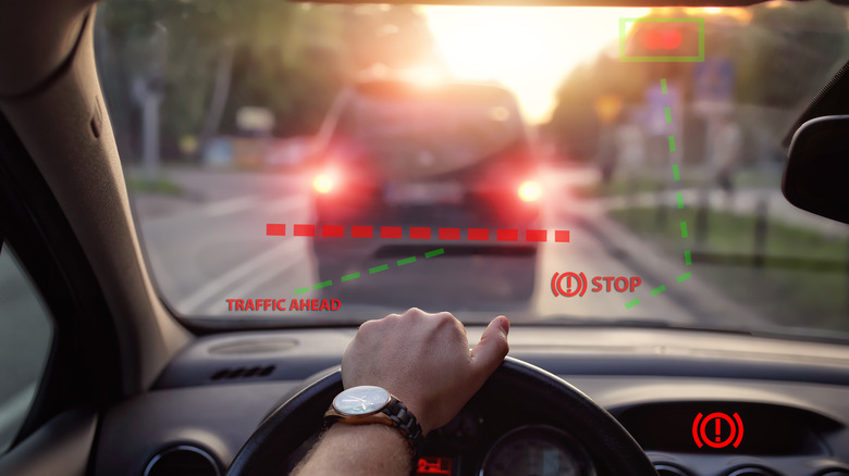 Stop signals appear on a hologram of a drivers windshield
