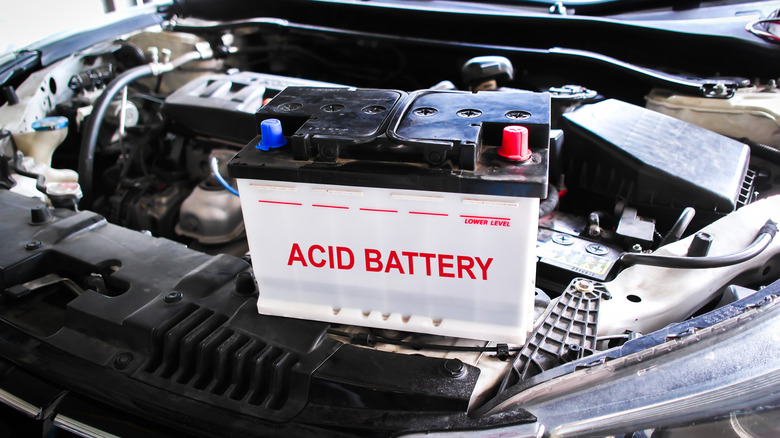 Lead acid battery on the engine compartment of a car