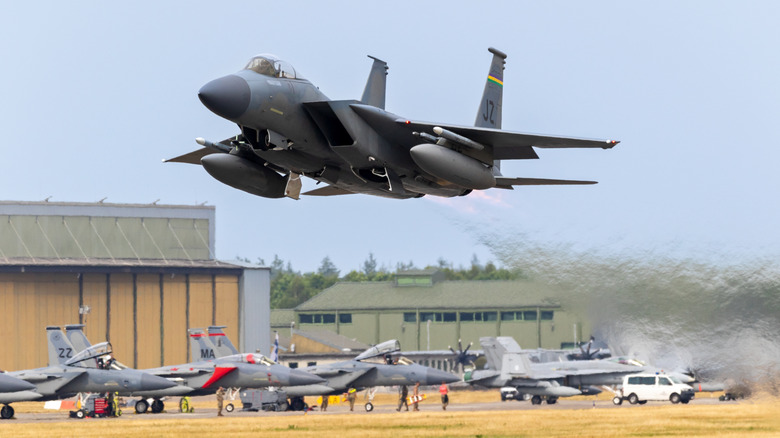 An F-15 Eagle fighter jet flying low