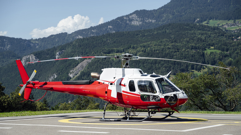 A helicopter stationary on a helipad.