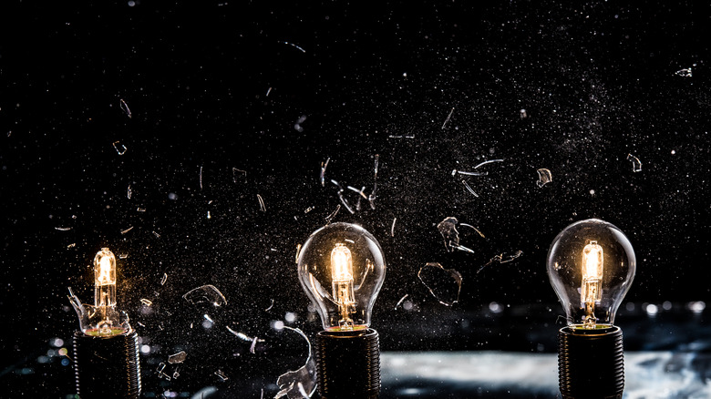 three light bulbs at different stages of exploding