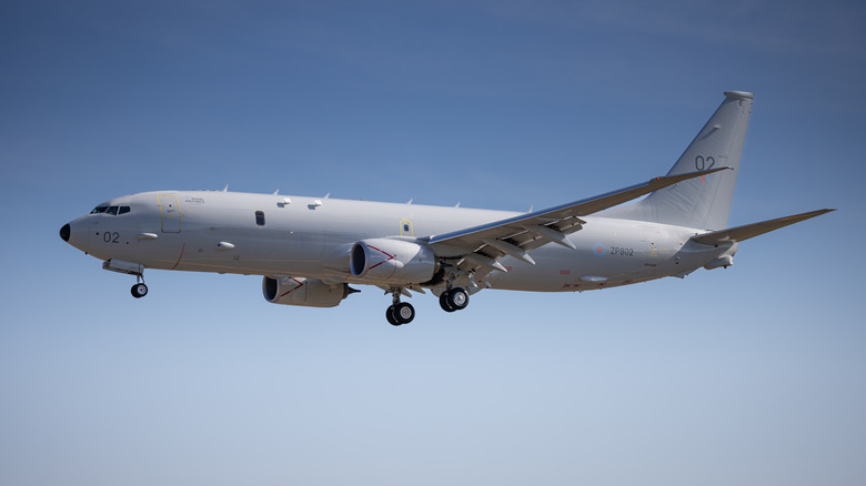 A P-8A Poseidon in flight with landing gear extended