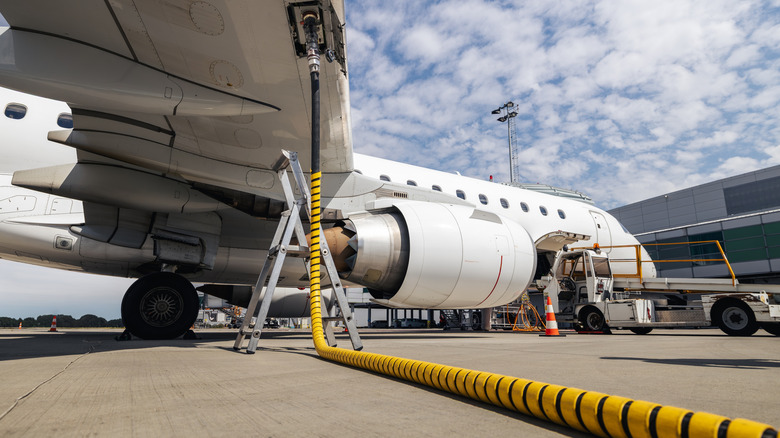 A jet is refueled at an airport