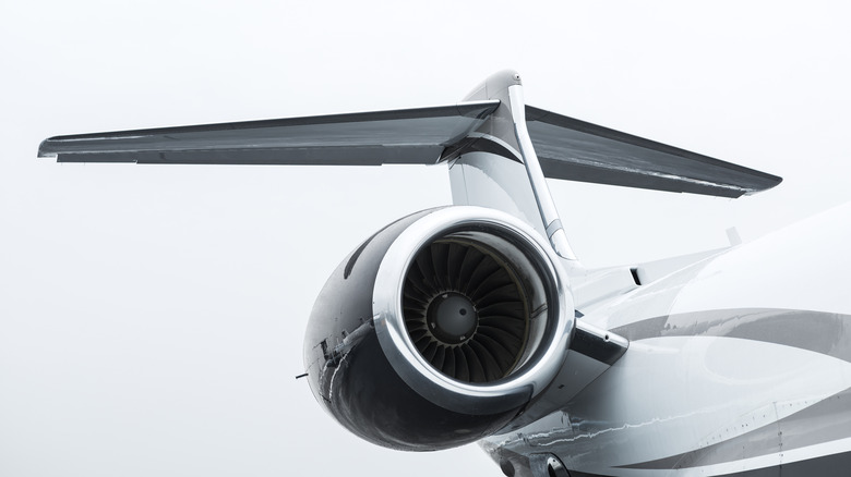 Private jet engine near the tail